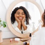 Girl sitting in front of mirror | Self-care products for women