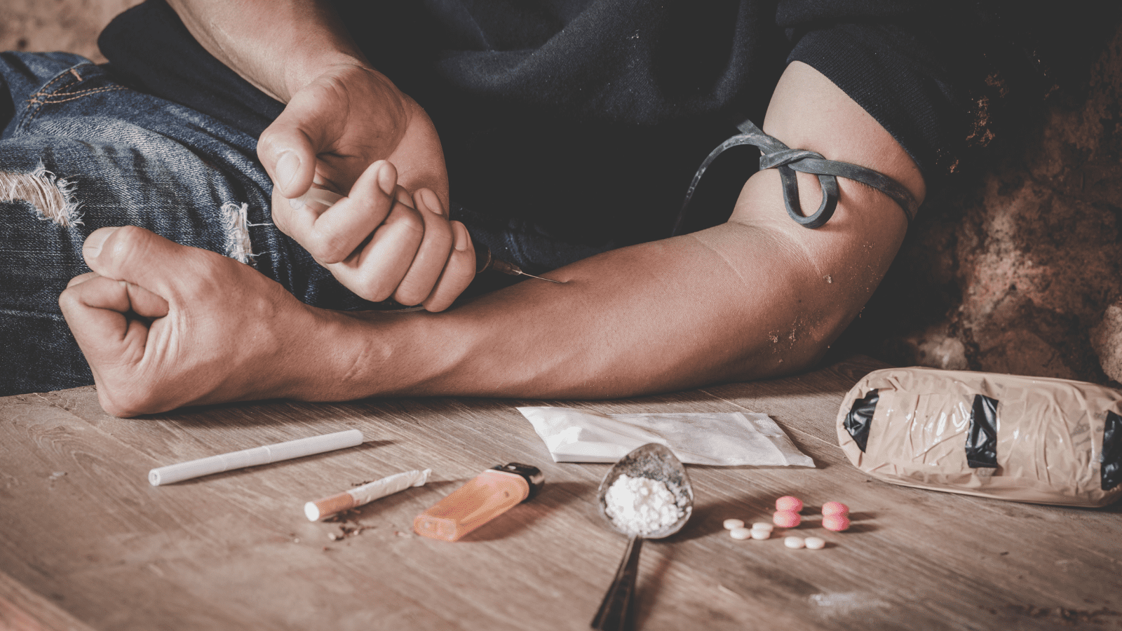 Man drugs addicted injecting heroin in his arm, Drug addict man with syringe using drugs, Drugs concept, 26 June, International Day Against Drug abuse.